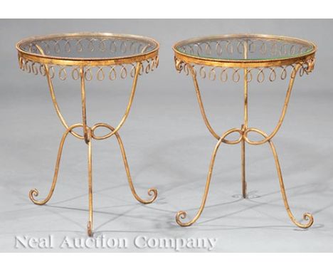 Pair of Hollywood Regency-Style Gilt Metal and Glass Occasional Tables, 20th c., h. 20 in., dia. 16 1/2 in. Ill.: Read, Mimi.