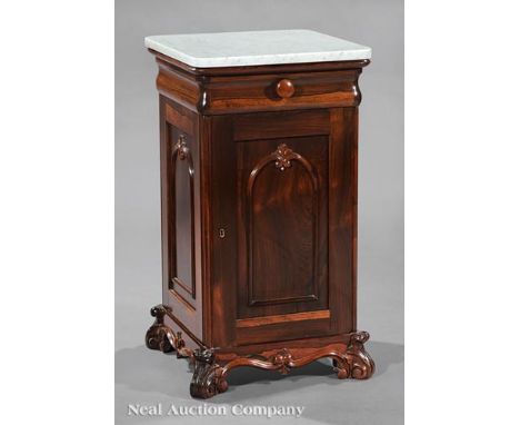 American Rococo Carved Rosewood Bedside Commode, mid-19th c., New York, later marble top, ogee drawer, arched paneled door, s