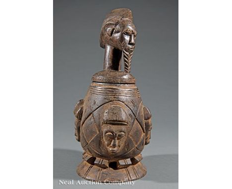 African Carved Wood Covered Box, Baoule Peoples, Guinea Coast or Ivory Coast, figural finial, mask carved body, h. 17 1/2 in.