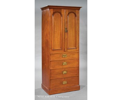 Arts and Crafts Carved Mahogany Cupboard, early 20th c., cove-molded cornice, pair of arched paneled doors, shelf interior, f