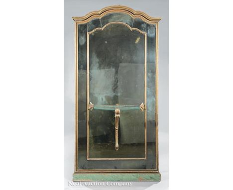 Giltwood Mirror, molded crest, segmented mirror plate centering a bracket shelf, h. 78 in., w. 39 in. Ill.: Read, Mimi. "A Hi