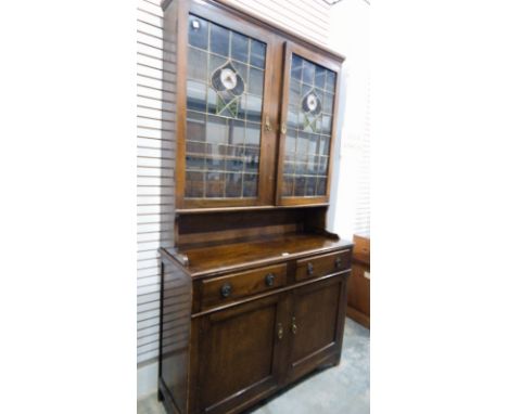 20th century stained beechwood glazed display cabinet with Rennie MacIntosh style stained glass windows, underneath two short