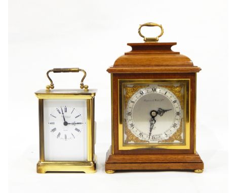 Carriage clock in lacquered brass case, the dial with Roman numerals and inscribed "Martin & Co, Cheltenham" with quartz move