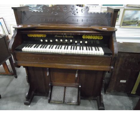 A Mason & Hamlin stained walnut harmonium Victorian marquetry inlaid figured cabinet with boxwood stringing, all enclosed in 