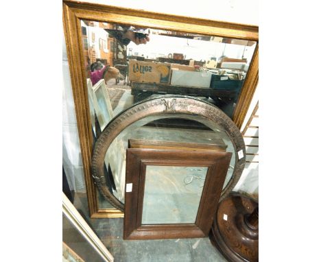 A circular mirror within an Art Nouveau style metal frame, and two other mirrors (3)