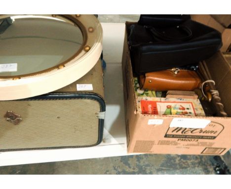 Large vintage trunk, a circular mirror with a painted wooden frame and gilt decorations, various handbags, table mats, assort