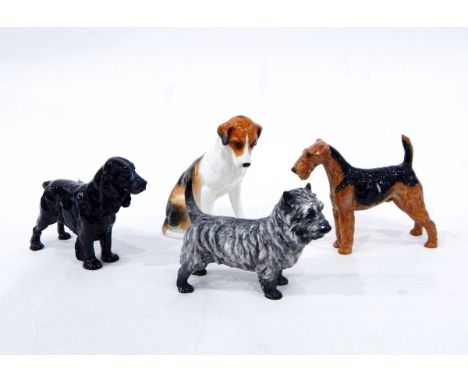 Royal Doulton model of a Cairn Terrier, HN1034, another of an Airedale, HN1023, three more Royal Doulton dog models (some wit