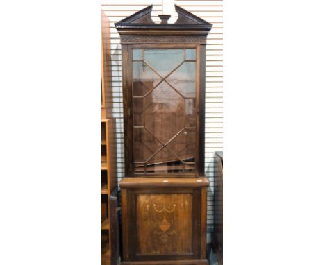 Edwardian mahogany display cabinet with broken arched pediment and dentil moulding, blind fretwork to frieze and marquetry in