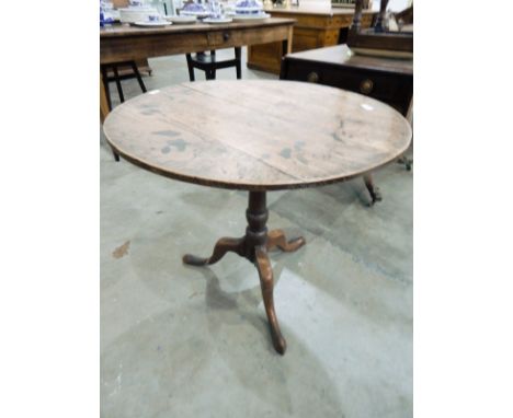 Georgian oak tilt-top table on turned tapered column, tripod scroll supports, pointed pad feet, 77cm wide 