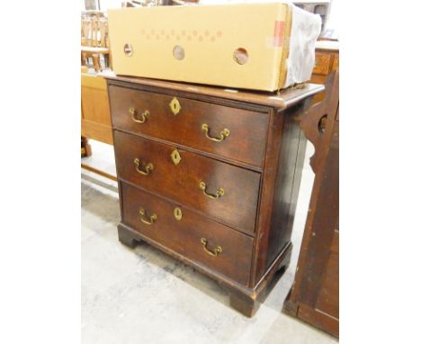 Small oak chest of three long graduated drawers, on shaped bracket feet, 74cm wide 