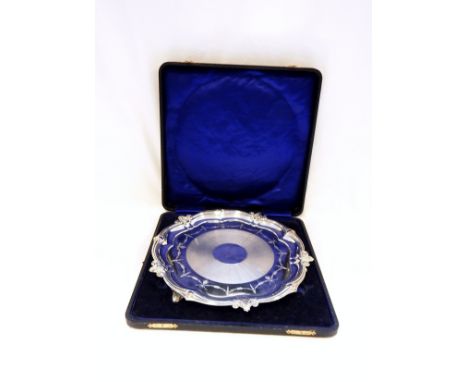 George V silver salver with fluted and scroll serpentine border, engine-turned band to the centre, with floral and husk swag 