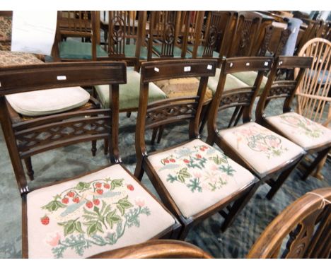 Set of four reproduction Regency dining chairs with diamond pierced crossrails, floral and bird tapestry cushions, on square 