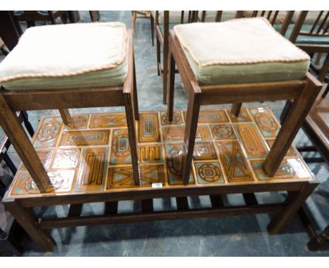 20th century tile-topped coffee table with undershelf, on square supports together with two 1960's stools and another (4) 