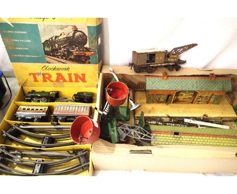 Hornby O gauge clockwork 0.4.0 loco and tender, two coaches, track, crane truck, stations, signals etc, all playworn, spares,