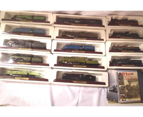 Fourteen boxed Atlas Edition static steam locomotive models and assorted paperwork. P&amp;P Group 3 (£25+VAT for the first lo