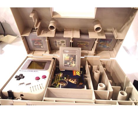 Gameboy portable DLX carry all case with Nintendo Gameboy and five games to include Toy Story. One instruction manual for Toy