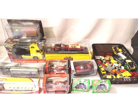 Selection of ten boxed vehicles, trucks, cars, tractors etc. Various scales, and two twenty two unboxed diecast. P&amp;P Grou