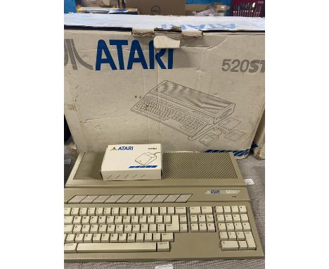 A boxed Atari 520ST console (powers up) 