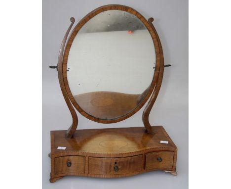 A Victorian mahogany, satinwood crossbanded and stung toilet mirror, the oval plate over a serpentine three draw base, on oge