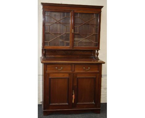 An Edwardian mahogany side cabinet, the upper height enclosed by a pair of astragal glazed doors over a pair frieze drawers a