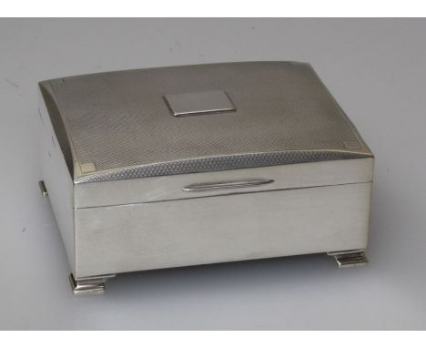 Henry Clifford Davis, a silver cigarette box, the slightly domed engine turned cover with vacant cartouche, plain body on oge