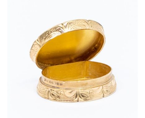 A 9ct gold pill/snuff box, oval form, machine engraved hinged lid with initial J, with scroll and floral decoration to approx