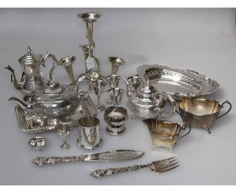 A mixed lot of EPNS including a four trumpet epergne, bread baskets, fish servers, part tea service and other similar wares