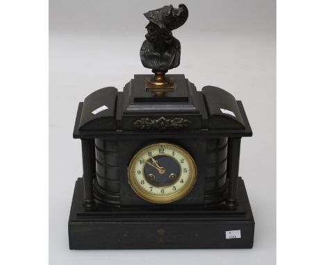 A 19th century black slate mantle clock with classical bust surmount over four column architectural case enclosing an eight d