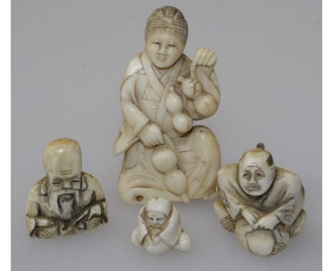 A 19th century ivory netsuke, carved as a robed seated female with gourds, 7.5cm together with three others, the smallest 0.7