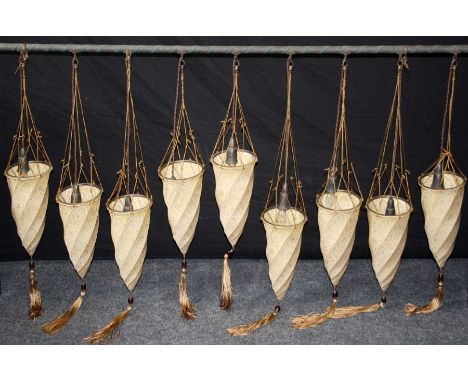 Fortuny, Venice. A set of nine cream wrythen conical silk ceiling light shades with gilt metal and tasselled glass bead mount