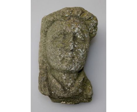 A nicely weathered natural stone antique corbel, possibly medieval, carved as the bust of a young woman with well defined fac