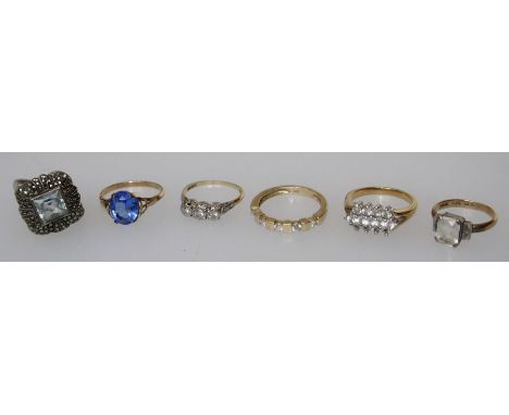An 18ct and platinum three stone diamond ring, total diamond weight approx. 0.15ct and a four stone diamond ring, total diamo