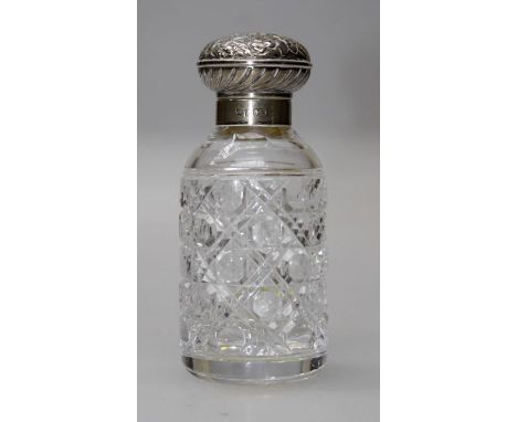 K H, a silver mounted cut glass dressing table scent bottle with floral repousse mushroom cap, Birmingham 1998. 14cm