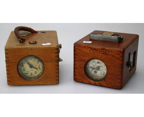 Robert Plasschaert, Belgium, a circa 1950's pigeon time recording clock, in oak case, together with another by Benzing&nbsp;