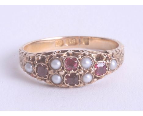 An 18ct yellow gold ruby and pearl set ring, size N.