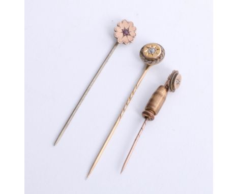 Three antique tie pins set with a diamond and ruby (one cased).