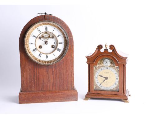 A mahogany cased mantle clock, the escapement visible on the dial, also an Elliott bracket clock with quartz movement (2).