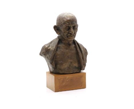 After Sadashiv Dattatray Sathe a bronze bust of Mahatma Gandhi, on a wooden plinth base39cm highCondition ReportDust in crevi