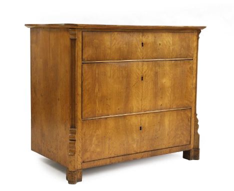 A satin birch commode 19th century, North European, the serpentine top over three long drawers, and canted corners,95cm wide5
