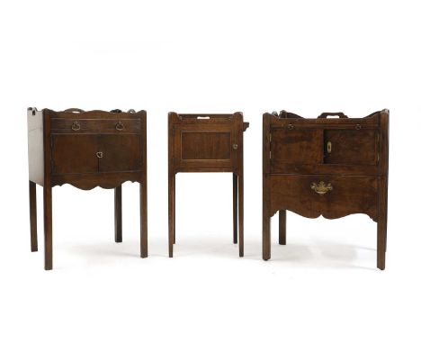 Three George III mahogany pot cupboards comprising; a commode example, with a tray top, and brushing slide, over two doors an