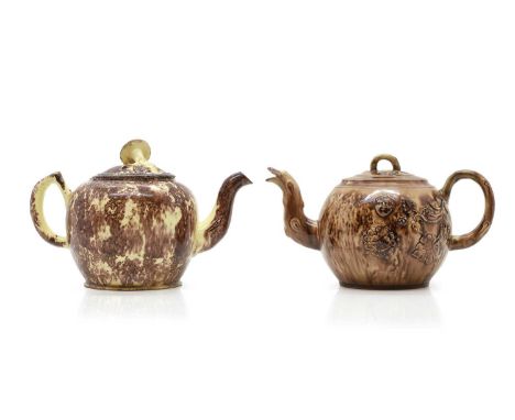 A Whieldon pottery teapot with spongeware decoration, the cover with a mushroom finial,18cm wide15cm hightogether with anothe