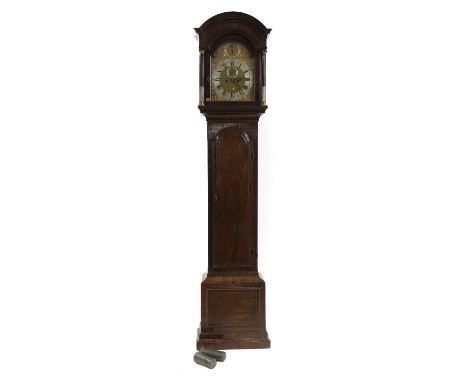 A George III mahogany eight-day longcase clock the arched brass strike, with silvered strike silent dial, chapter ring and ca