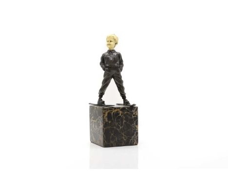 After Ferdinand Priess  'Ski Boy', an Art Deco style bronze and faux ivory figure, raised on a black and ochre viened marble 