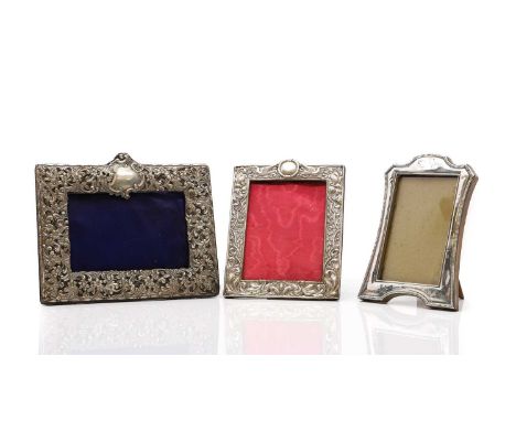 A group of three silver photograph frames the first by Henry Matthews, Birmingham 1897, with pierced floral decoration, 18 x 