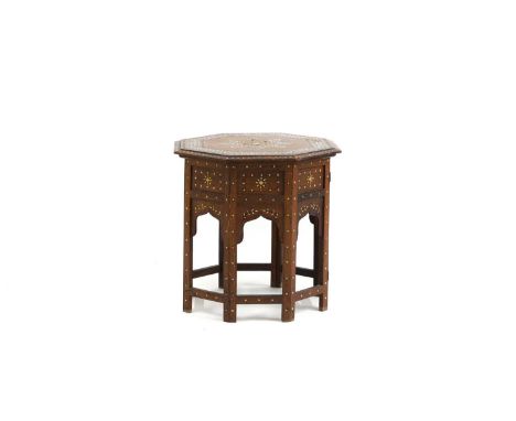 An ivory and brass inlaid teak hexagonal table  20th century, Indian, with folding base 46cm wide 46cm high  IMPORTANT NOTE  
