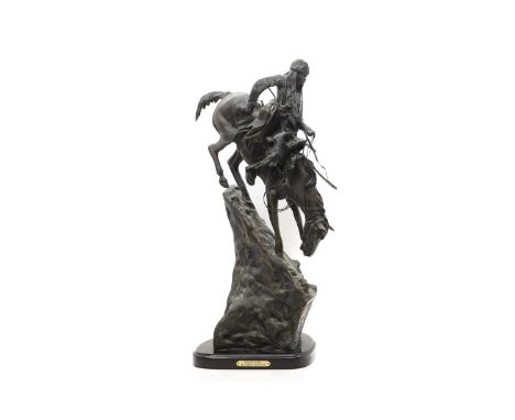 After Frederick Remmington 'Mountain Man', a bronze figure of a Native American riding a horse down a slope,69cm highConditio
