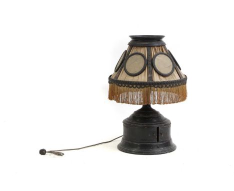 A modernist table lamp  with integrated gramophone, the curved metal base with two doors, opening to a turntable, the shade w