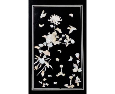 A Chinese lacquer panel inlaid with mother of pearl flowers, birds and a butterfly, etc., 60.5cm x 36cm. (AF one piece loose)