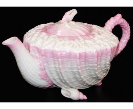 A first period Belleek pink ground Neptune teapot and cover, the coral moulded body sitting on shell feet and shell knop, 12c