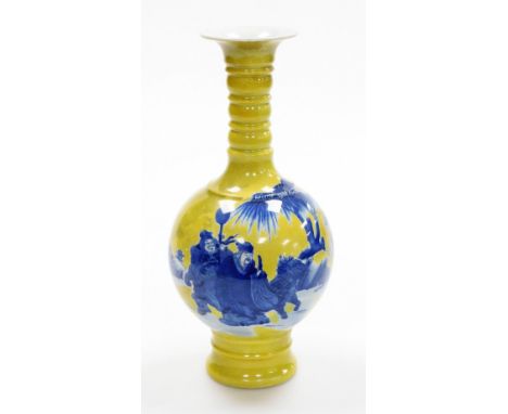 A Chinese porcelain gourd vase, the top with tapered stem, on a yellow ground with blue wash figures of warriors in seascape,